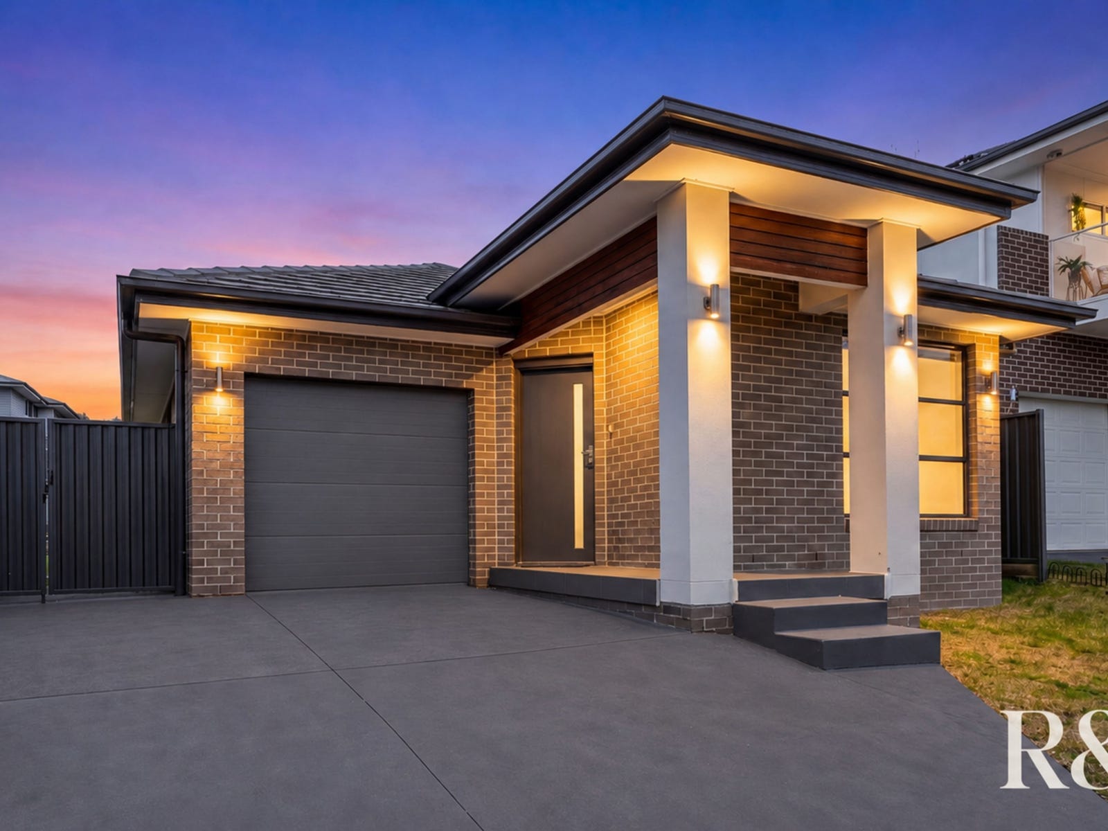 Professional twilight exterior photograph of 9 Arkley Avenue, Claymore